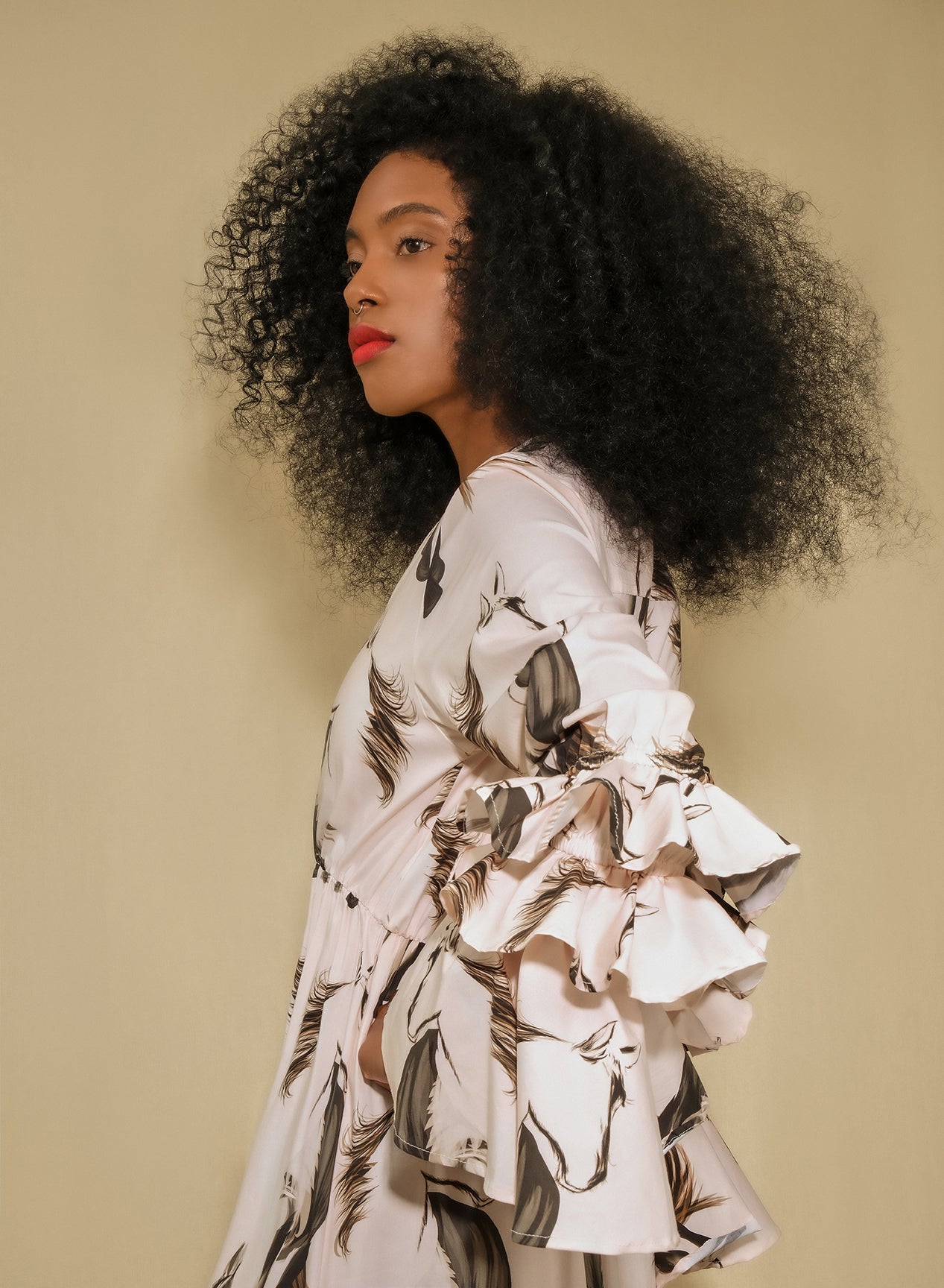 Model wearing horse print poplin maxi shirt dress with ruffle sleeves and asymmetrical tiered skirt