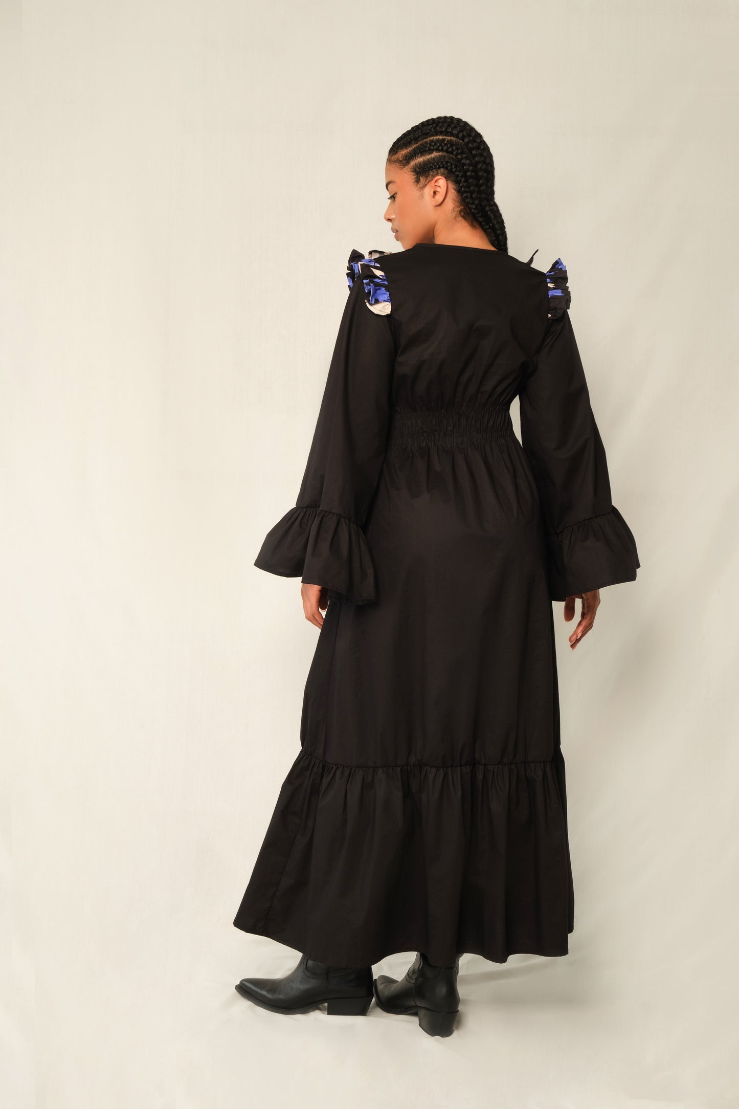 Black ruffle V-neck maxi dress with Jacaranda print trim, bell sleeves, tiered hem, and waist tie