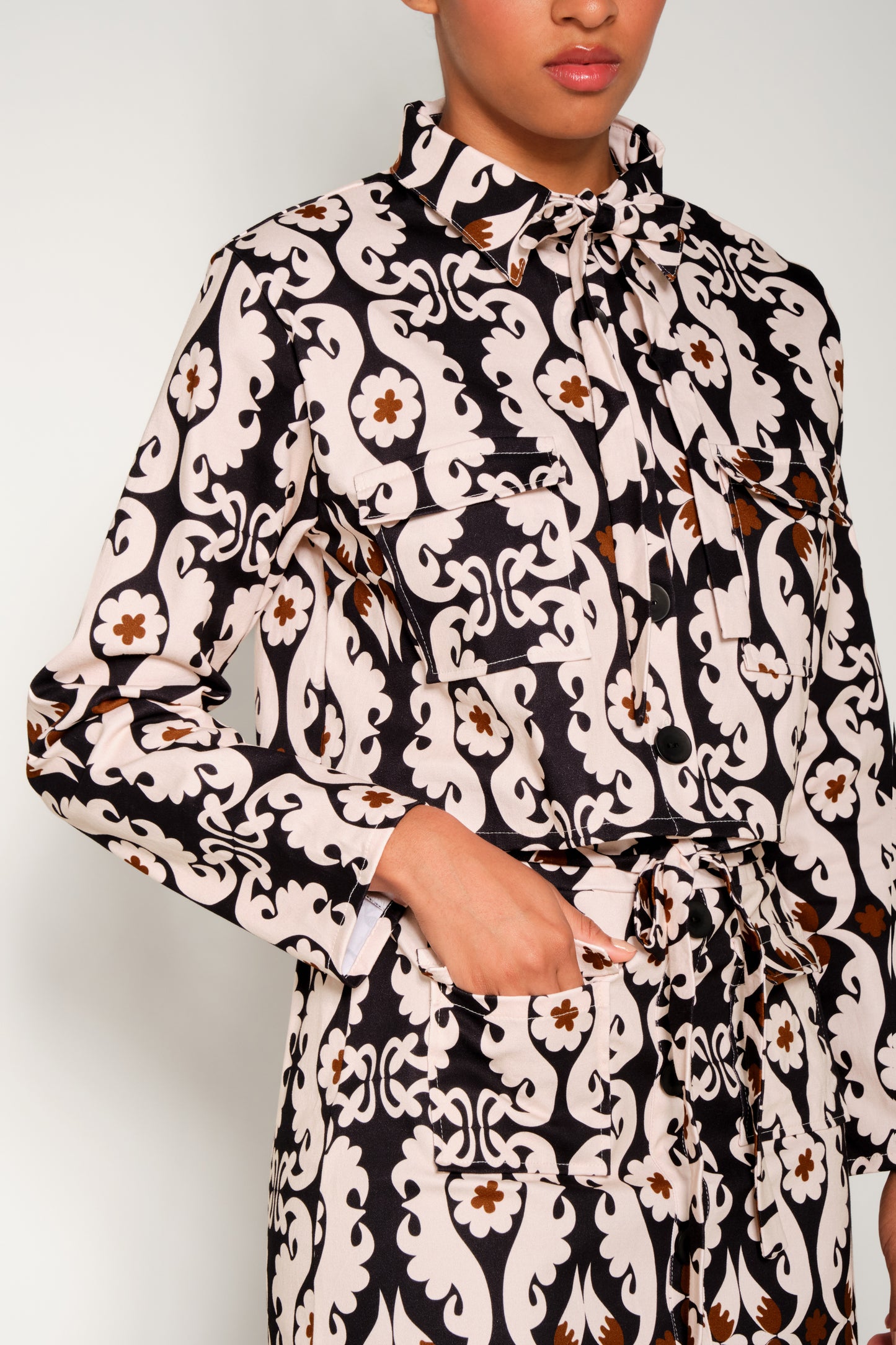 Model wearing cropped paisley jacket in heavy cotton with flap pockets