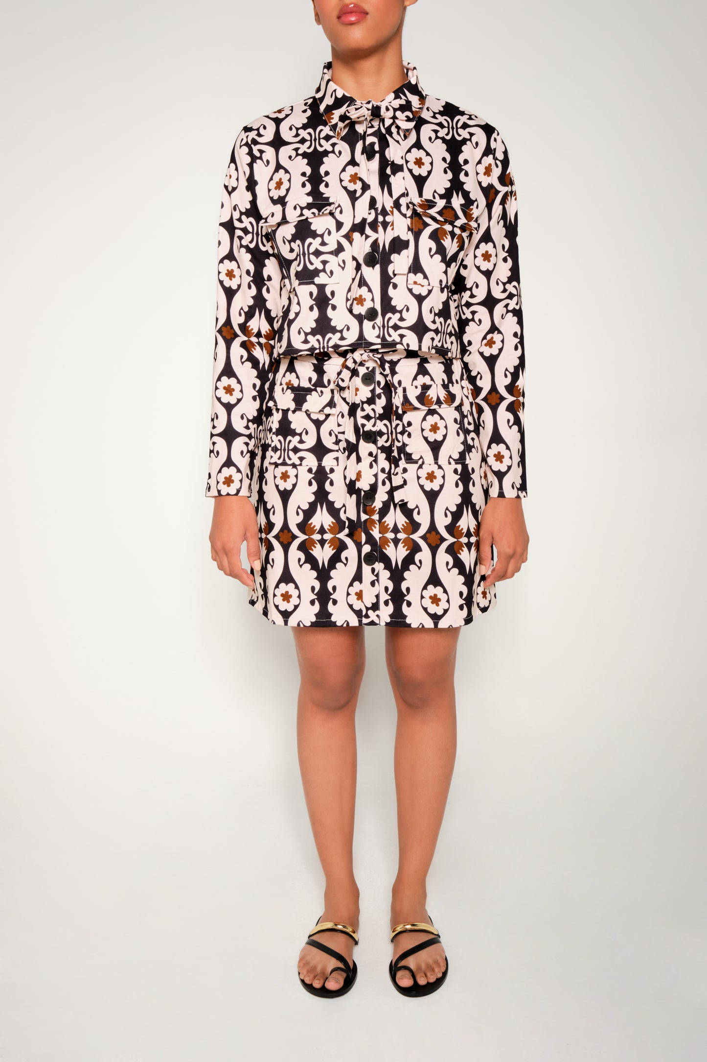 Model wearing cropped paisley jacket in heavy cotton with flap pockets