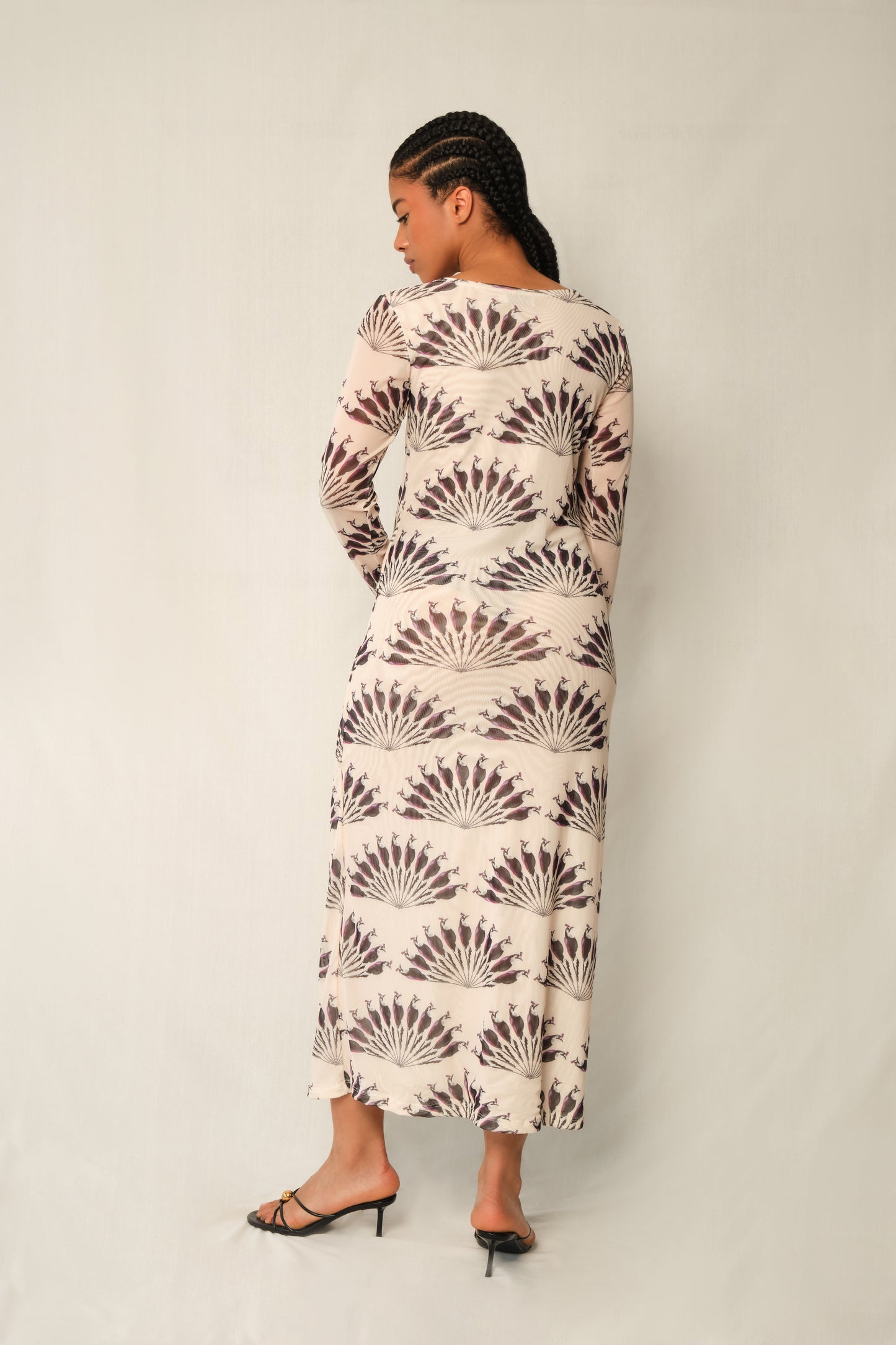 Model wearing long-sleeve mesh column maxi dress