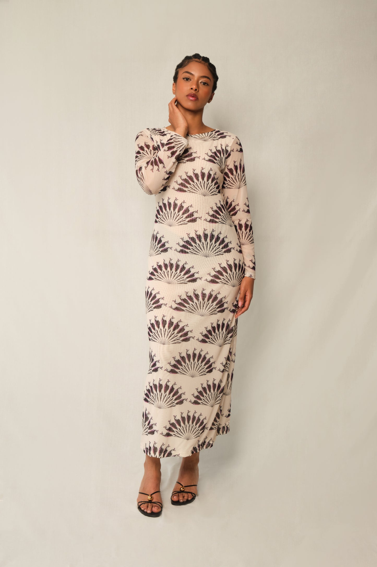 Model wearing long-sleeve mesh column maxi dress