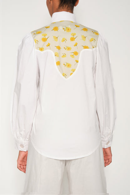 Model wearing women’s western yoke poplin shirt with Mini Daisy floral panel, front view.