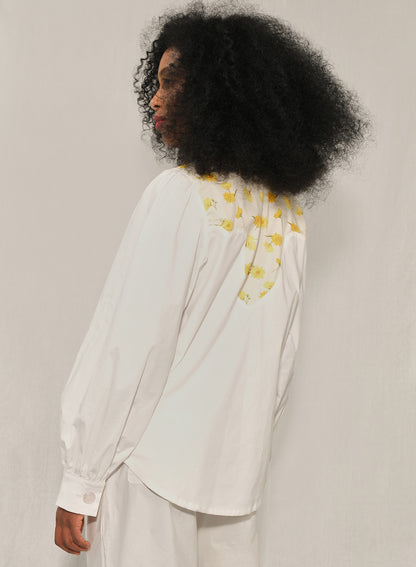 Model wearing women’s western yoke poplin shirt with Mini Daisy floral panel, front view.