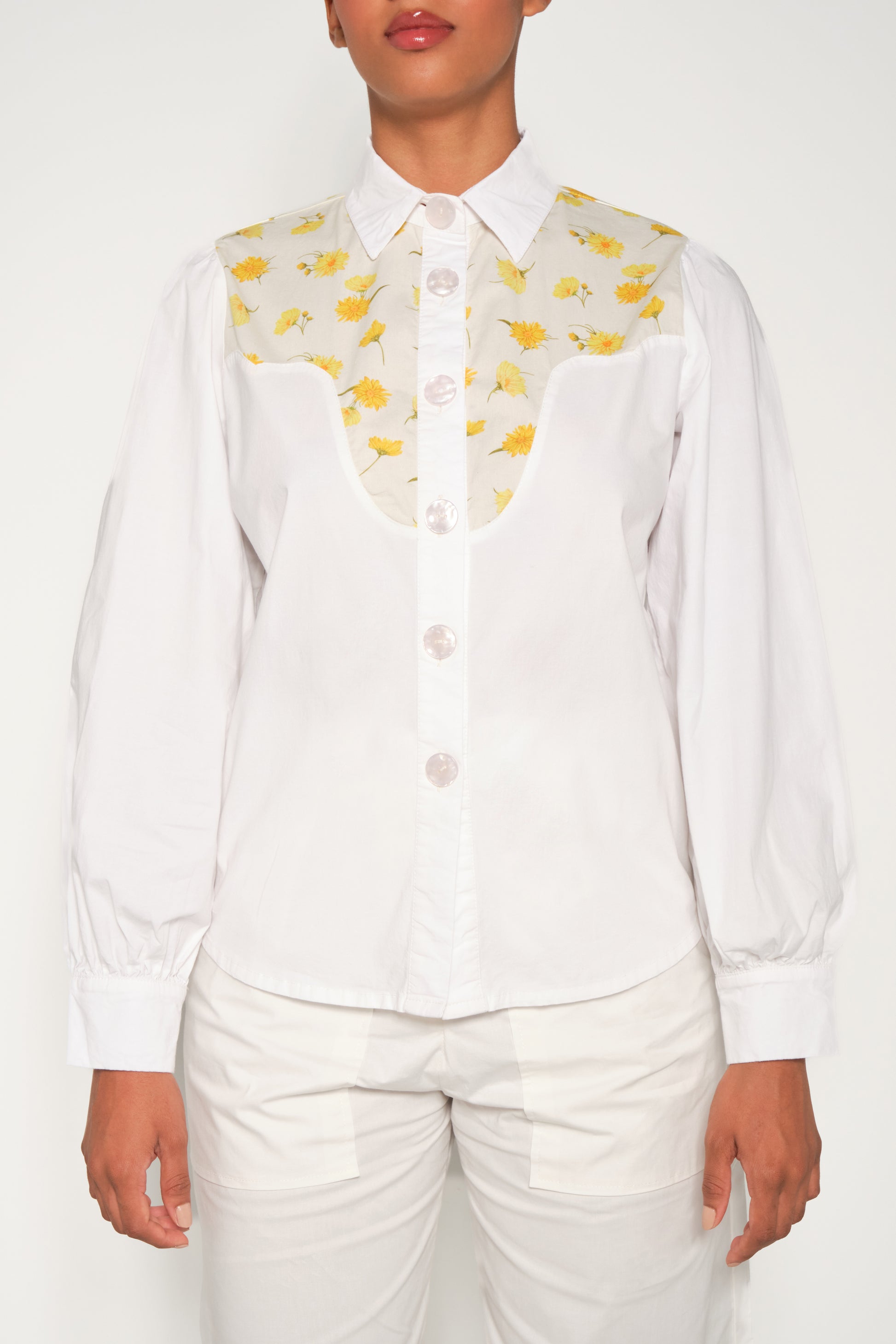 Model wearing women’s western yoke poplin shirt with Mini Daisy floral panel, front view.
