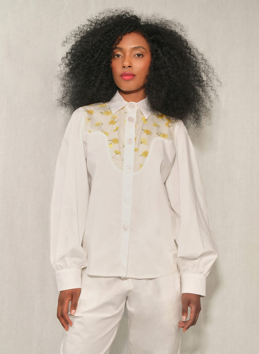 Model wearing women’s western yoke poplin shirt with Mini Daisy floral panel, front view.