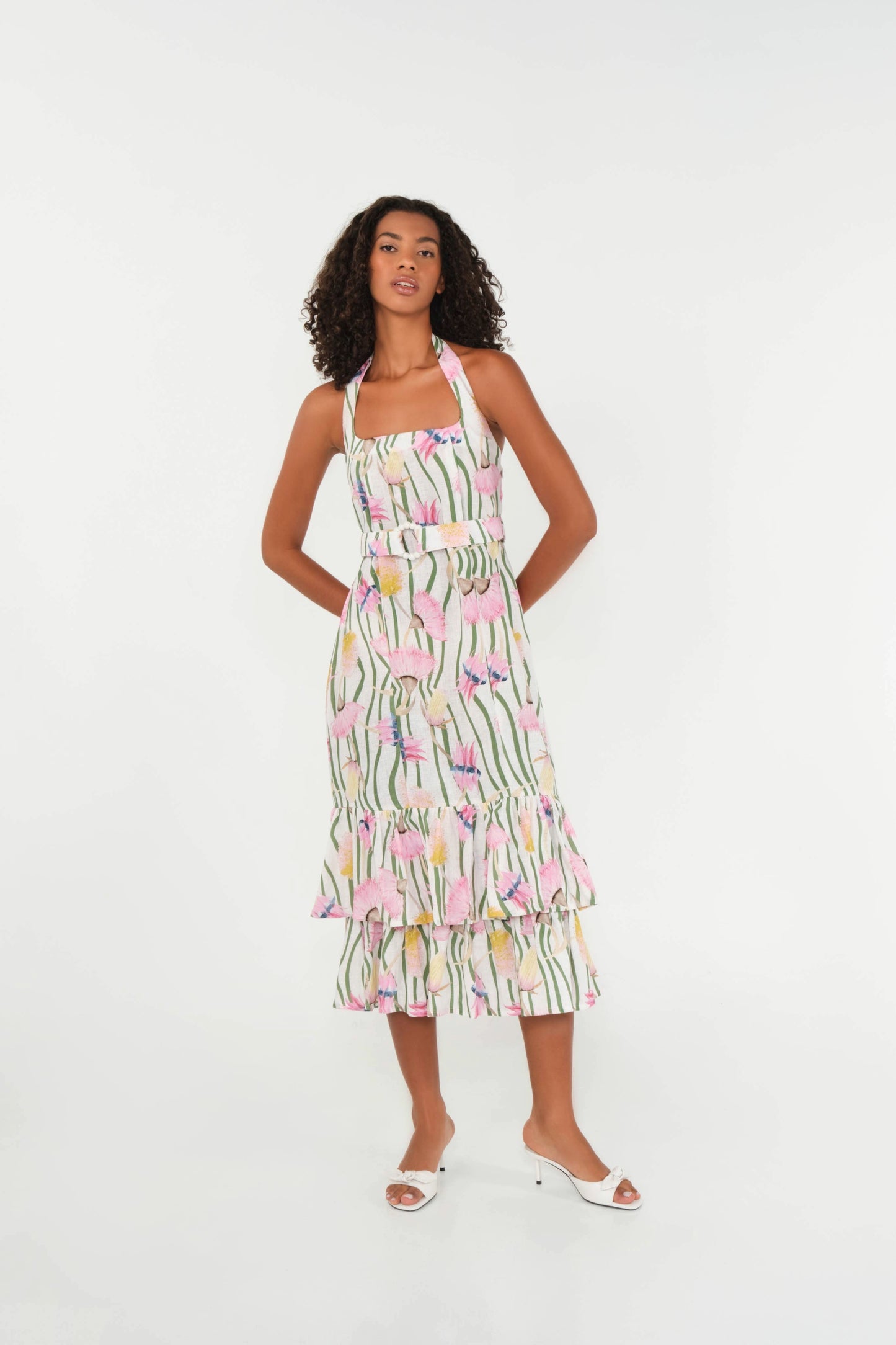 Woman wearing a floral dress on a white background