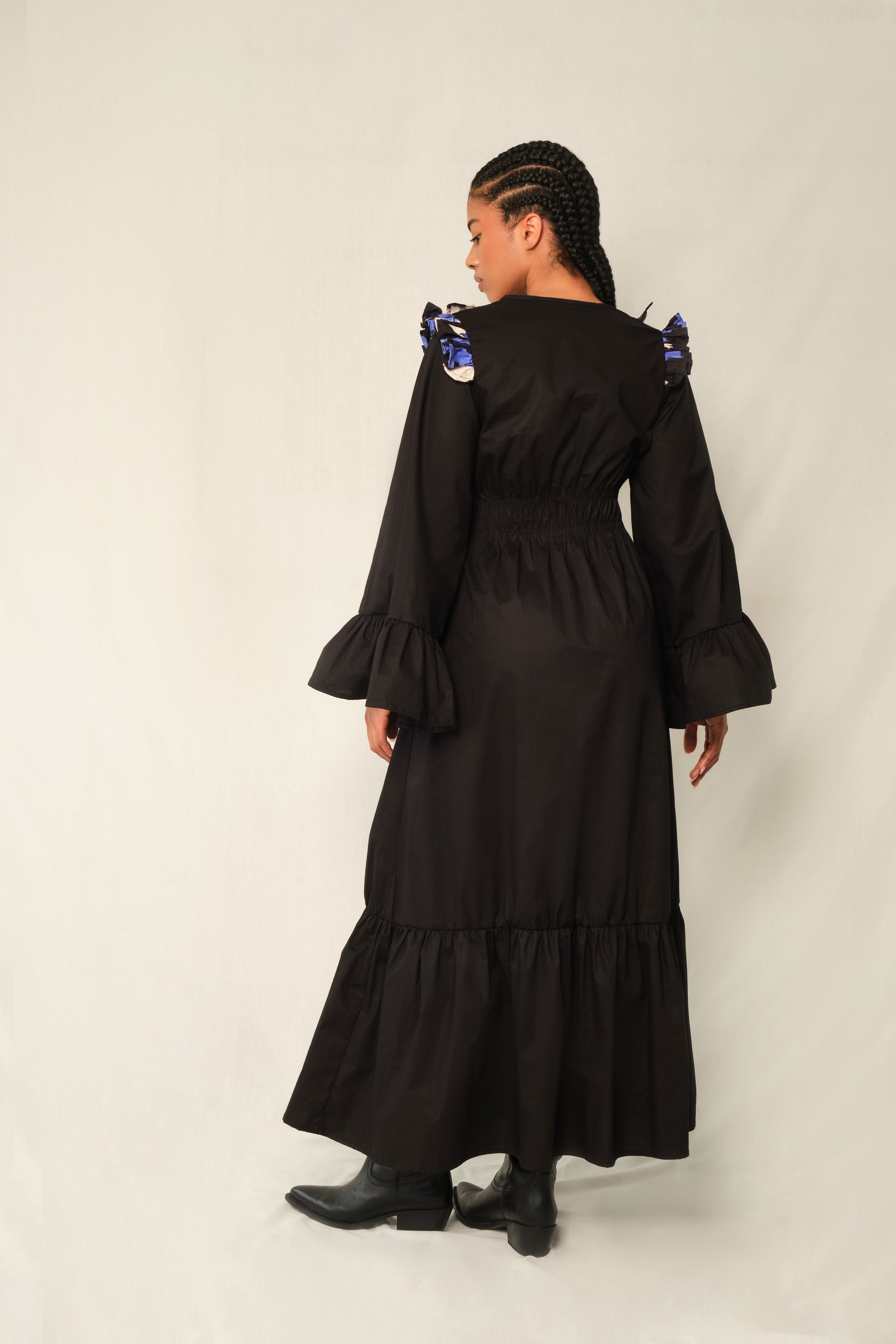 Black ruffle V-neck maxi dress with Jacaranda print trim, bell sleeves, tiered hem, and waist tie