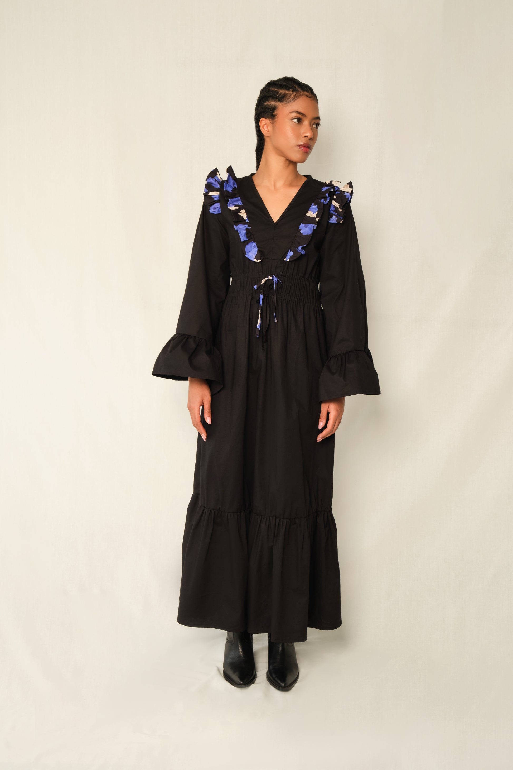 Black ruffle V-neck maxi dress with Jacaranda print trim, bell sleeves, tiered hem, and waist tie