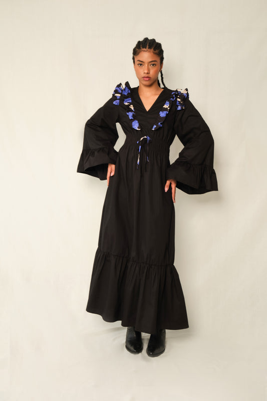 Black ruffle V-neck maxi dress with Jacaranda print trim, bell sleeves, tiered hem, and waist tie