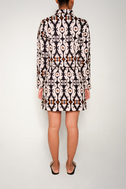 Model wearing paisley button-front mini skirt