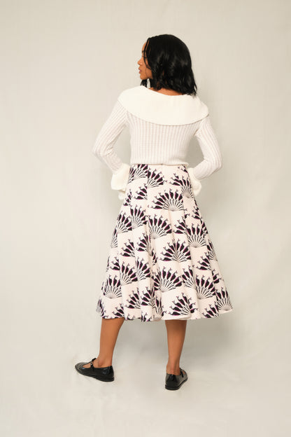 Model wearing A-line panel midi skirt in Throated Ivory print with topstitch seams.