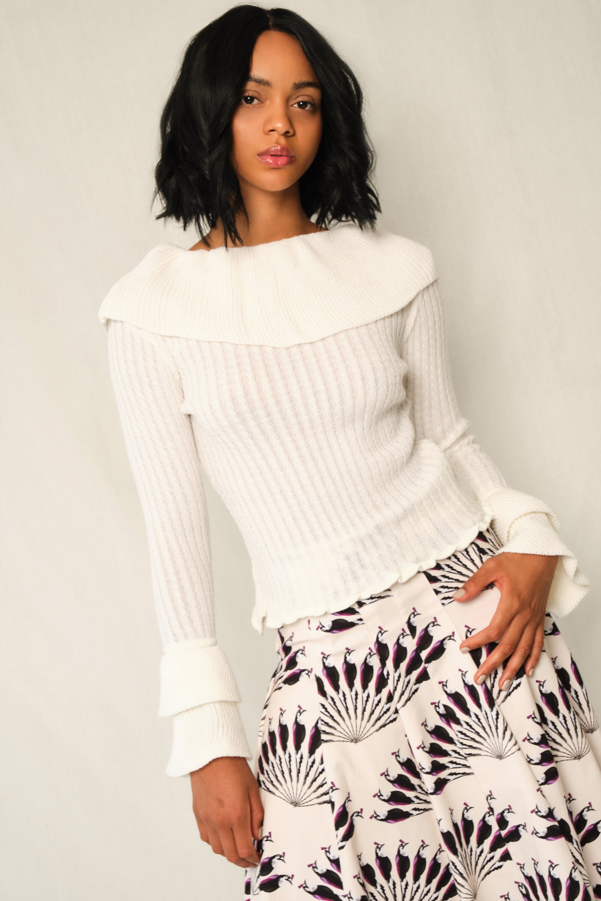 Model wearing A-line panel midi skirt in Throated Ivory print with topstitch seams.