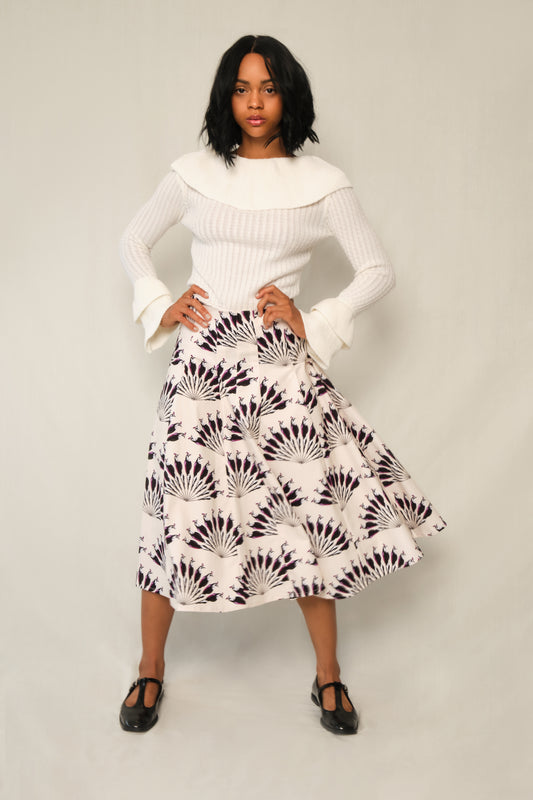 Model wearing A-line panel midi skirt in Throated Ivory print with topstitch seams.