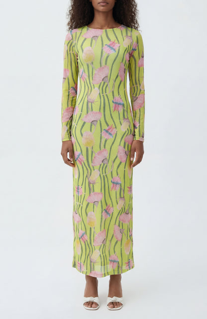 Woman wearing a long-sleeve dress with a floral pattern on a white background