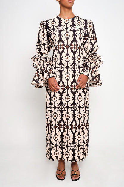 A model wearing tunic dress with ruffle sleeves