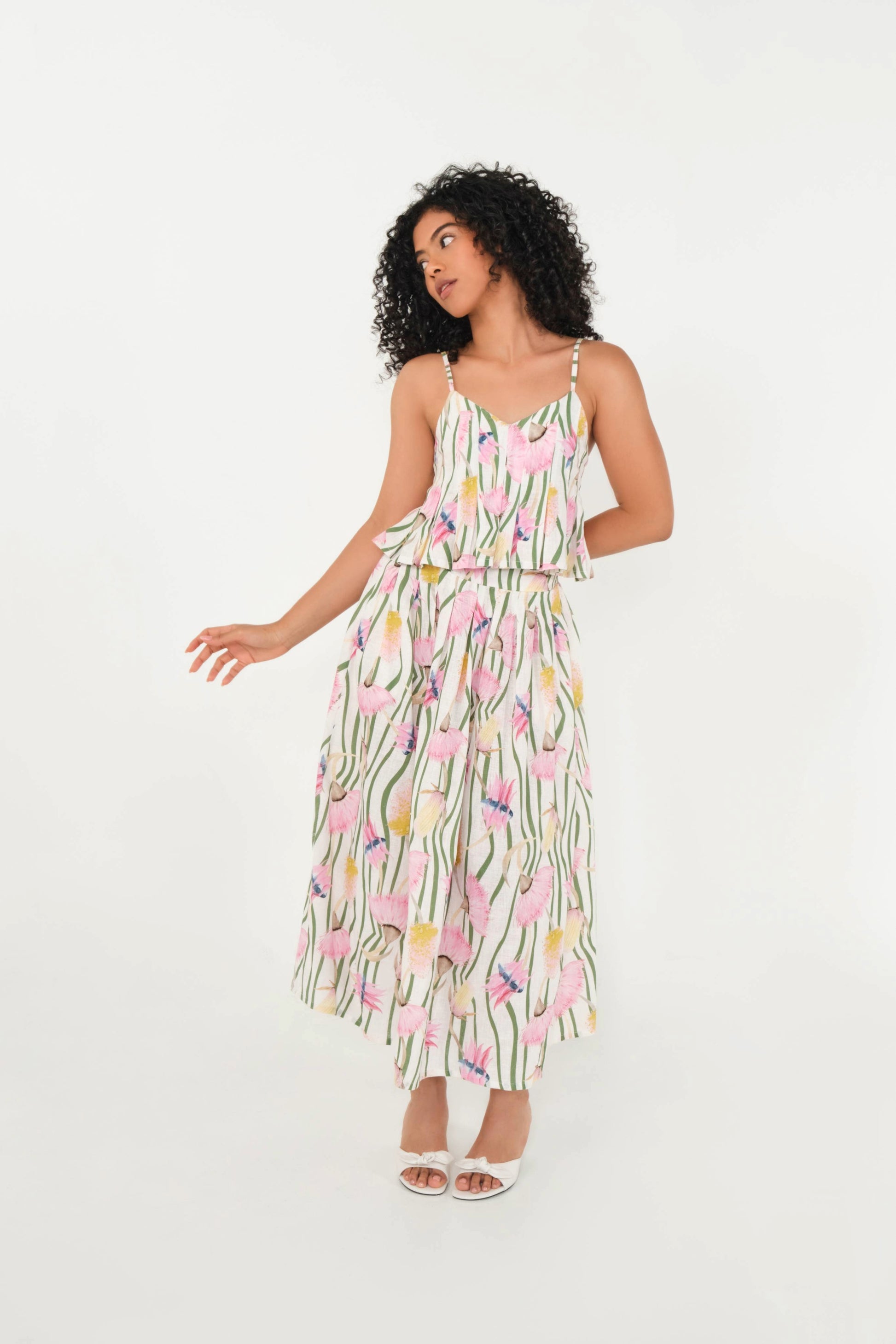 Woman wearing a floral dress on a white background