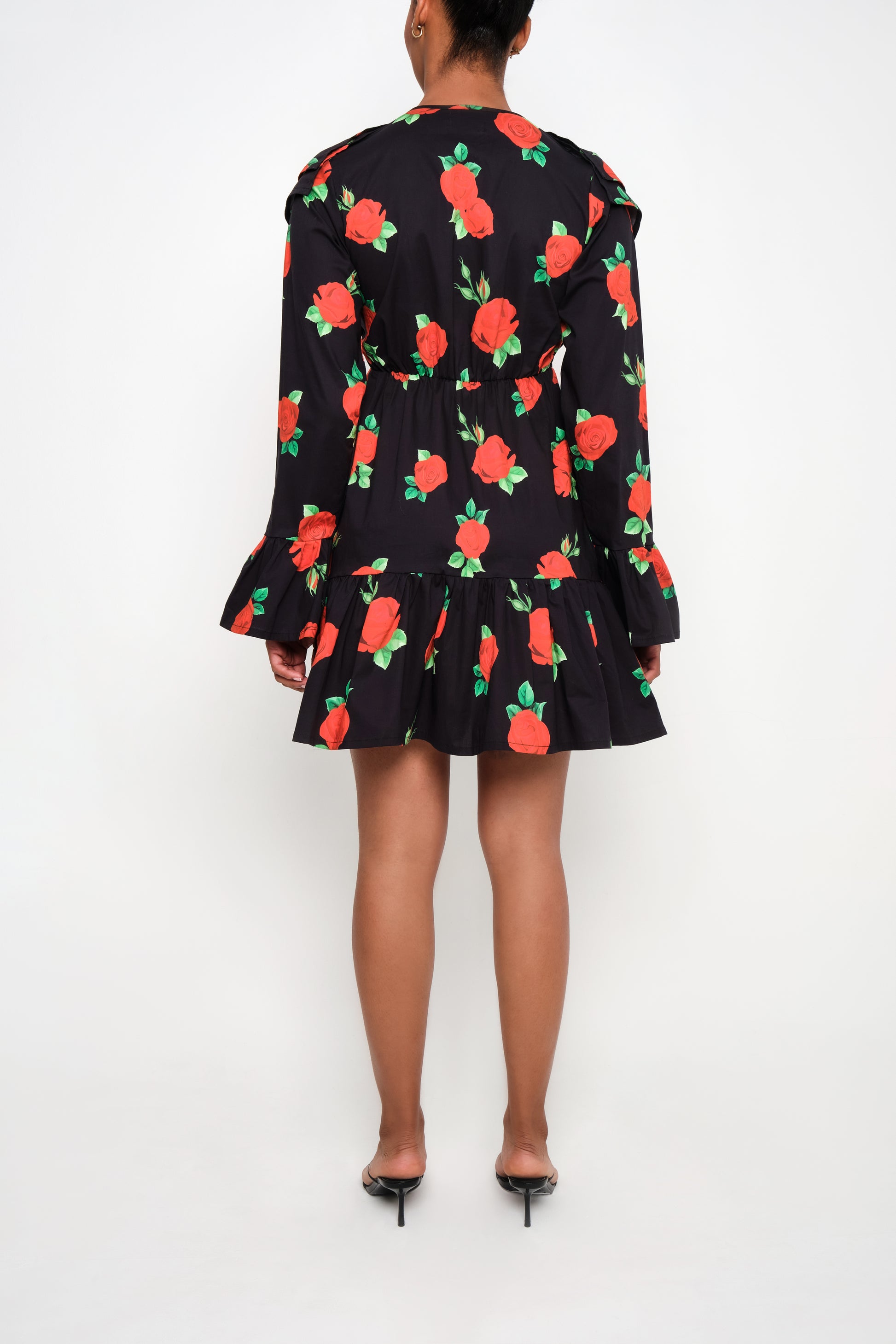 Model wearing tiered poplin mini dress with ruffle collar and Maxi Roses print