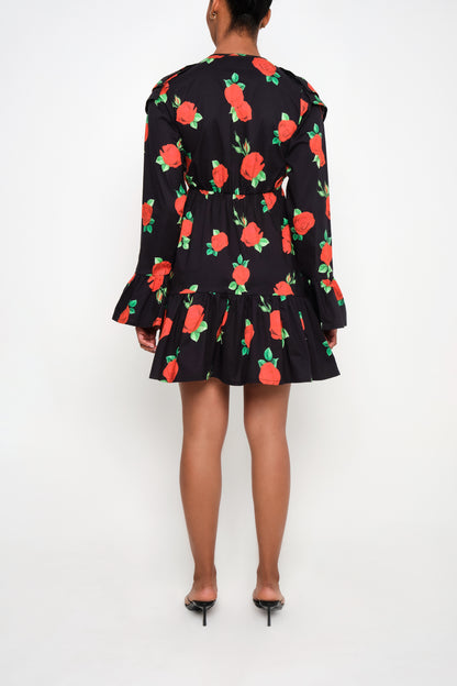 Model wearing tiered poplin mini dress with ruffle collar and Maxi Roses print