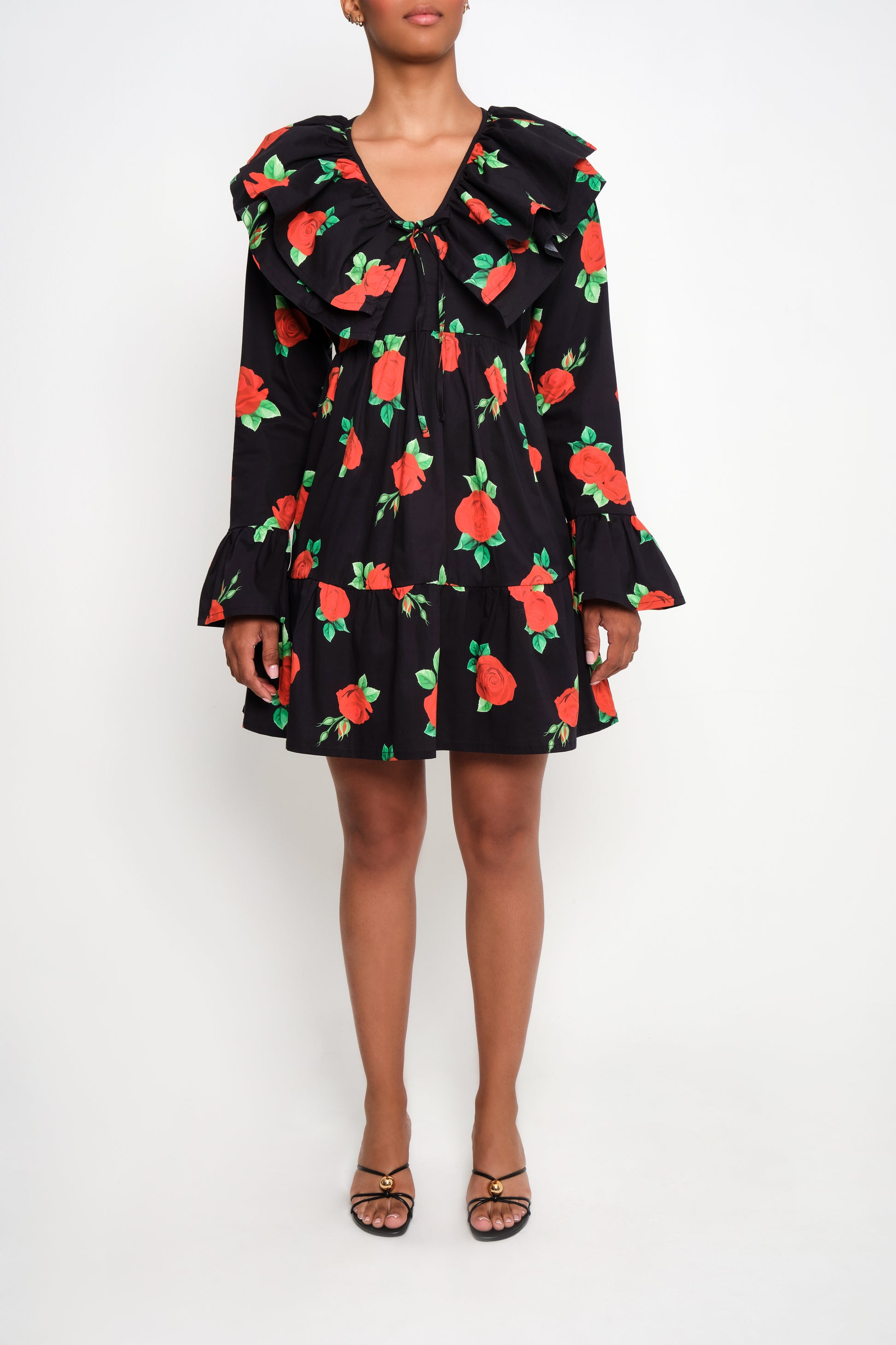 Model wearing tiered poplin mini dress with ruffle collar and Maxi Roses print